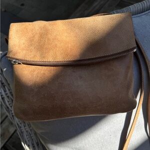 Roots Tan Leather Bag measures approx 8x10 when folded.